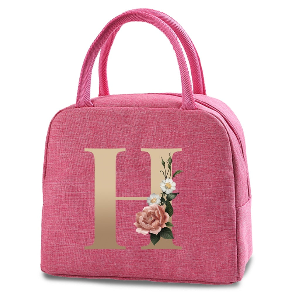 Bolso portátil con estampado de letras e iniciales doradas, ideal para guardar comida