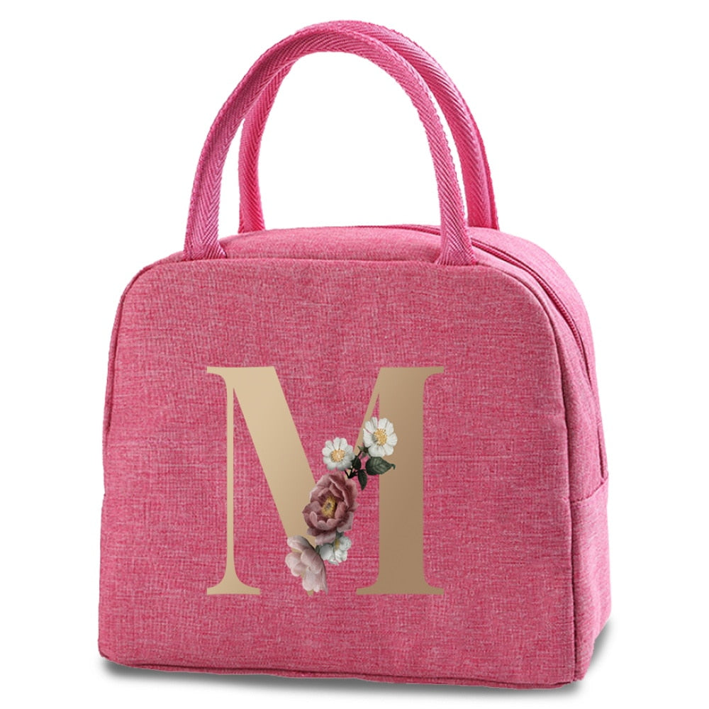 Bolso portátil con estampado de letras e iniciales doradas, ideal para guardar comida