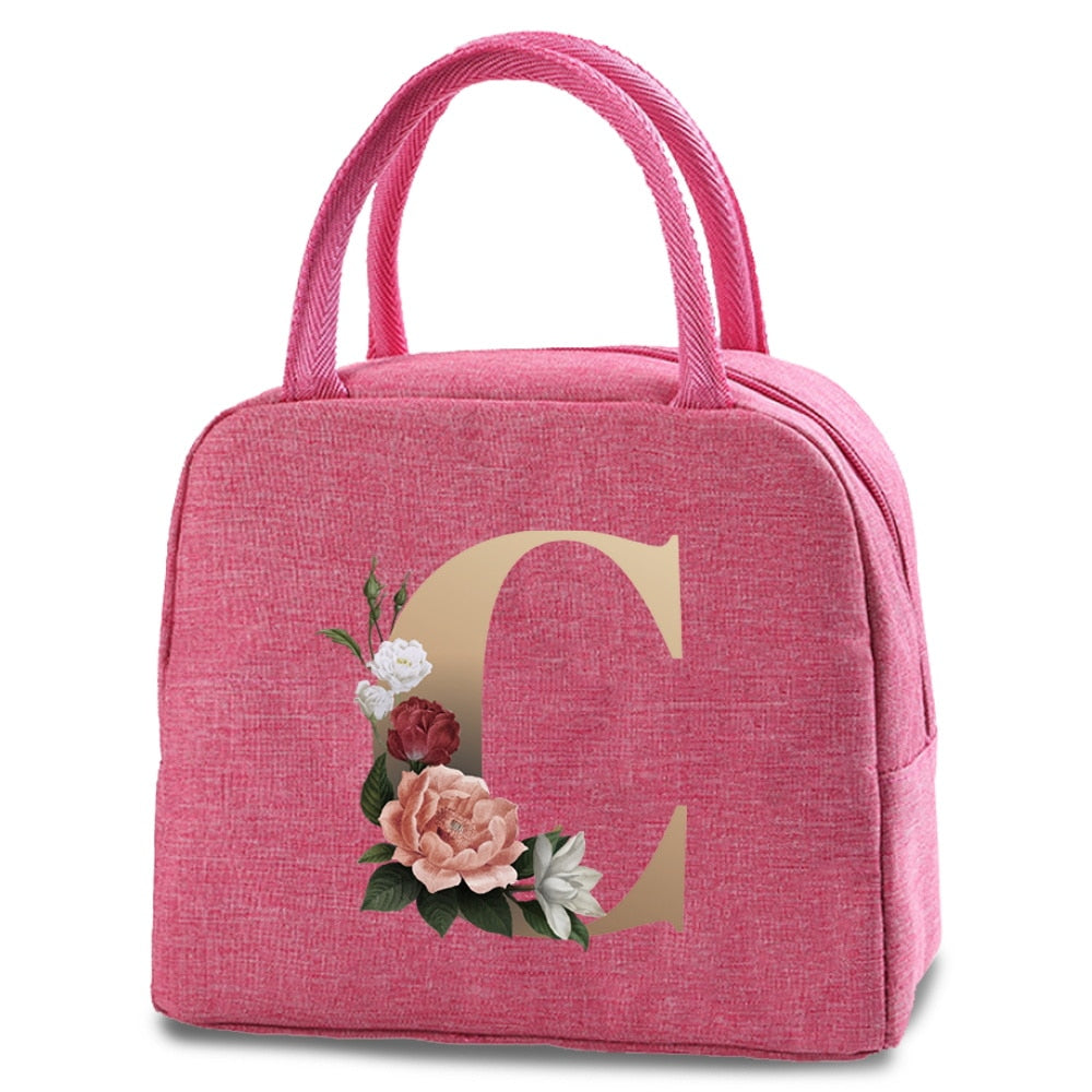 Bolso portátil con estampado de letras e iniciales doradas, ideal para guardar comida