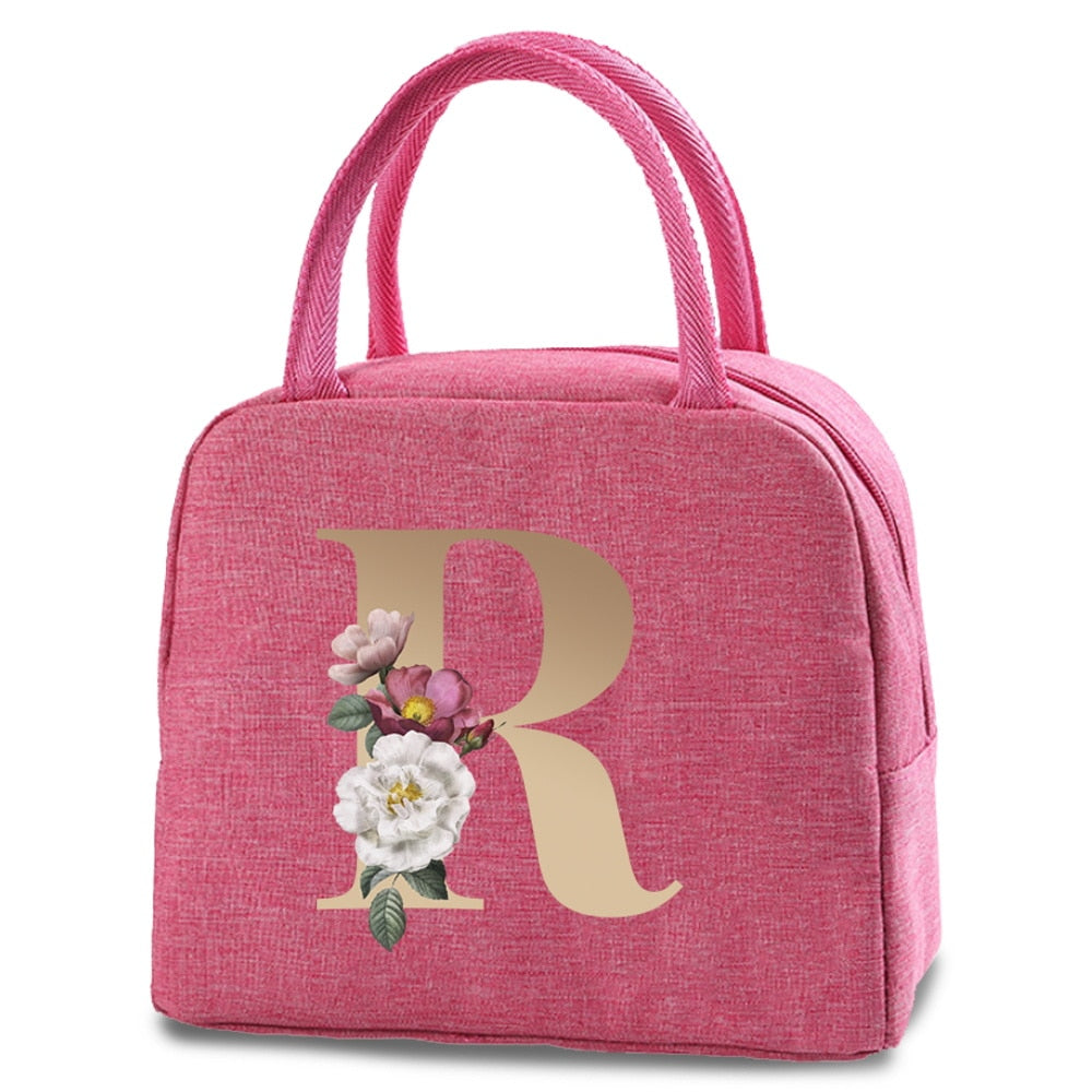 Bolso portátil con estampado de letras e iniciales doradas, ideal para guardar comida